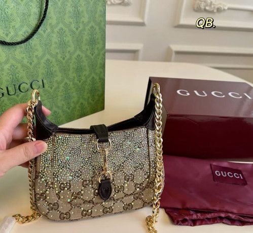Guccii Jackie Notte mini bag featuring a crystal embellished